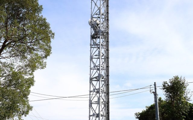 A steel telecommunications tower carrying panel antennas in Japan