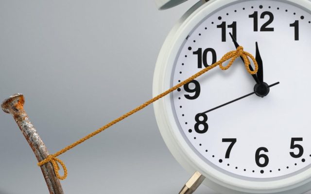 A clock stopped by a nail attached with rope, illustrated cable access equipment