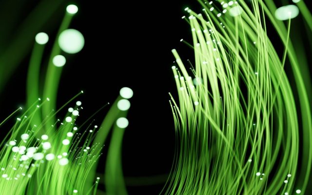 Optical fibre strands lit from the end against a dark background (Light Reading)