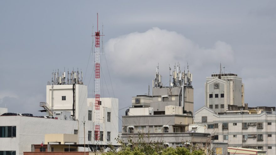 Mobile network antennas and communications equipment on a rooftop