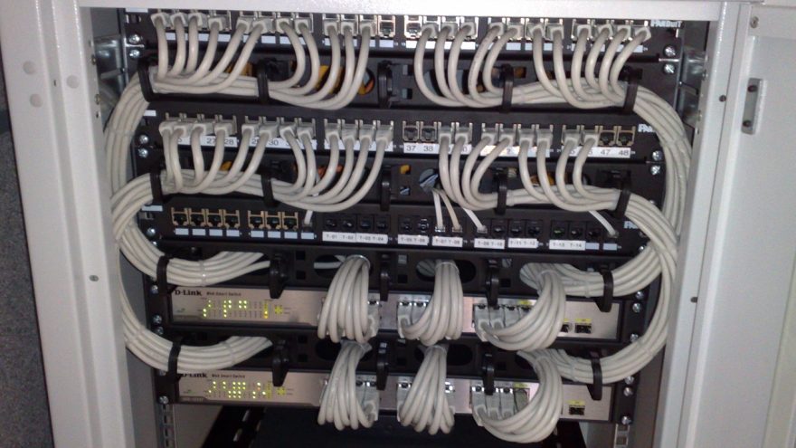 19-inch rack holding rackmount Ethernet switches and patch panels in a network cabinet