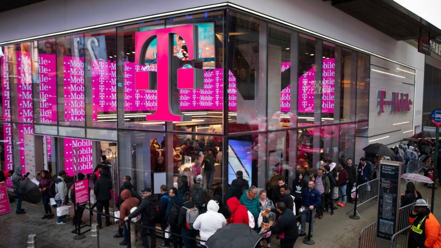 T-Mobile retail store front with people lined up outside