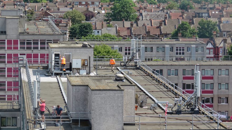 Cellular network antenna mounts on a rooftop installation